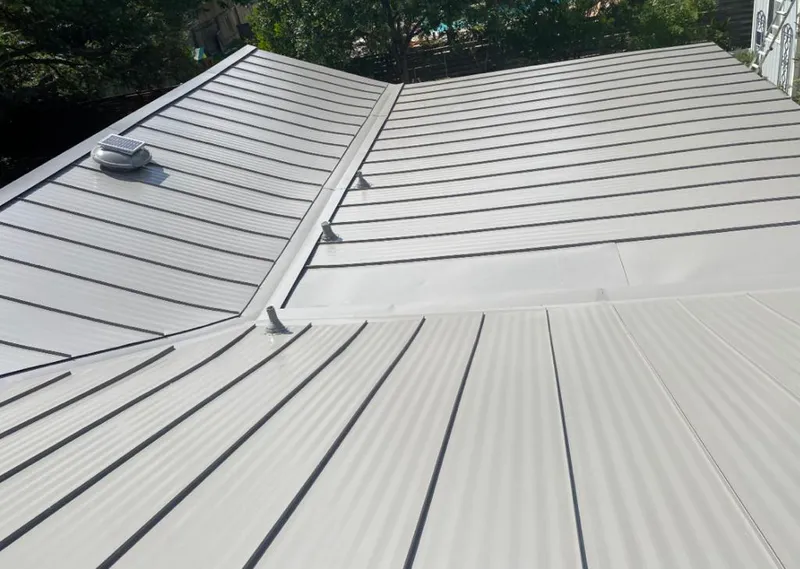 Solar attic fan installed on a metal roof for Roof Ventilation in Waldorf